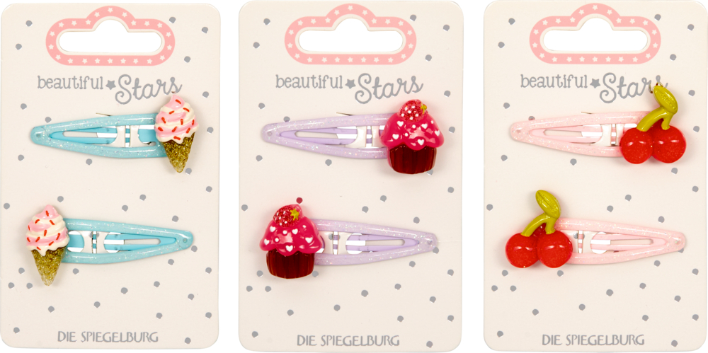 Drei Sets bunte Haarspangen mit Eis, Cupcake und Kirschen auf verzierten Karten.
