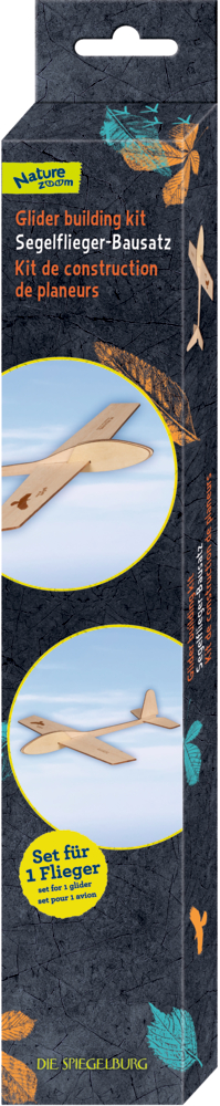 Hohe Box mit Holz-Segelflugzeug-Bausatz und Anleitung in Englisch, Deutsch und Französisch.