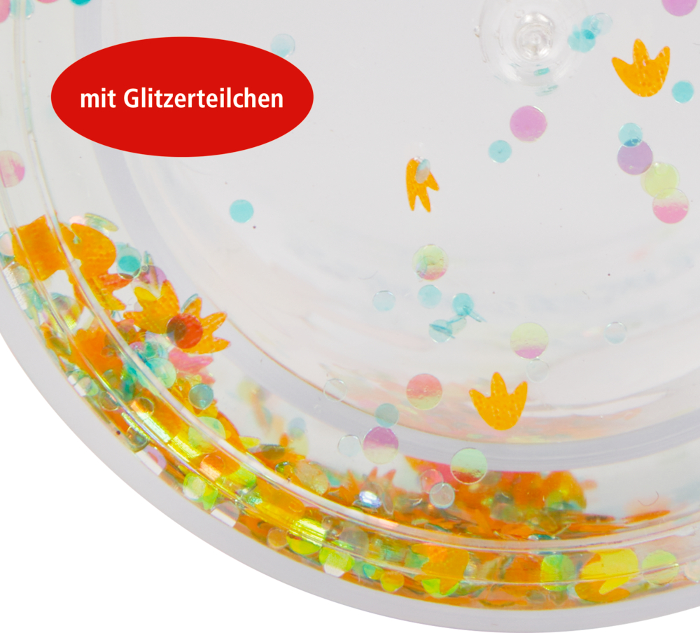 Nahaufnahme eines Bechers mit buntem Glitzer und Konfetti, versehen mit einer roten Aufschrift: „mit Glitzerteilchen“.