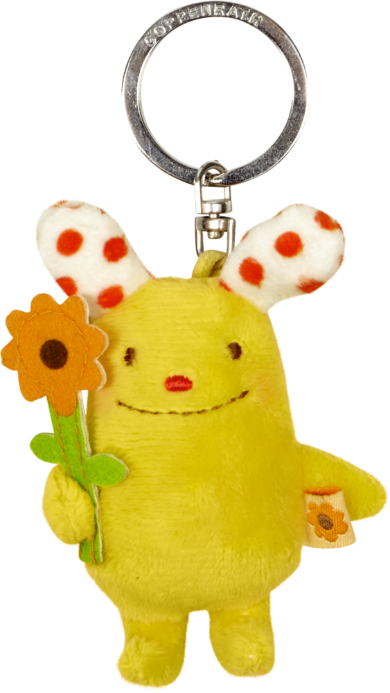 Schlüsselanhänger Der kleine Sonnenschein (Das kleine Glück) Gelbe Plüfigur-Schlüsselanhänger mit gepunkteten Ohren, die lächelt und eine orangene Filzblume hält.