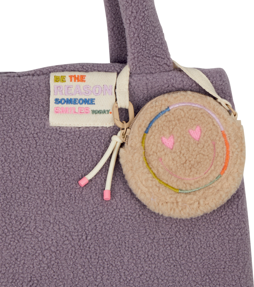 Lilafarbene Fleece-Tragetasche mit Smiley-Tasche und Aufnäher: „Seien Sie der Grund, warum heute jemand lächelt.“.