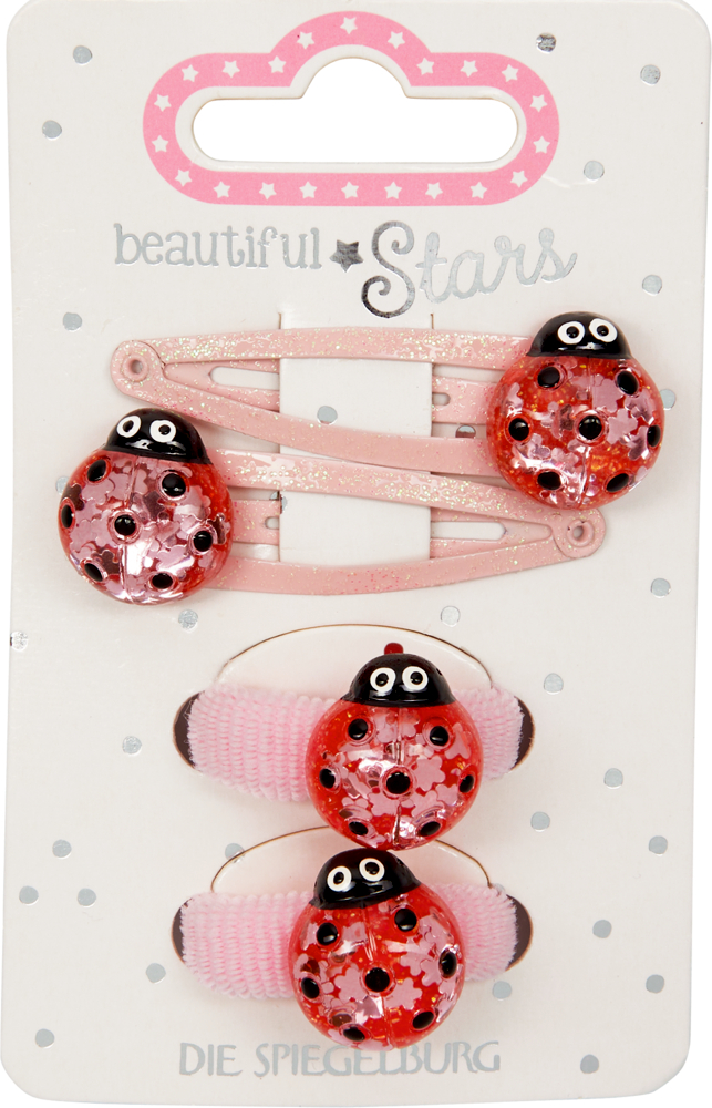 Set aus rosa Haarspangen und Haarbändern mit roten Marienkäfer-Verzierungen, präsentiert auf einer dekorativen Karte.