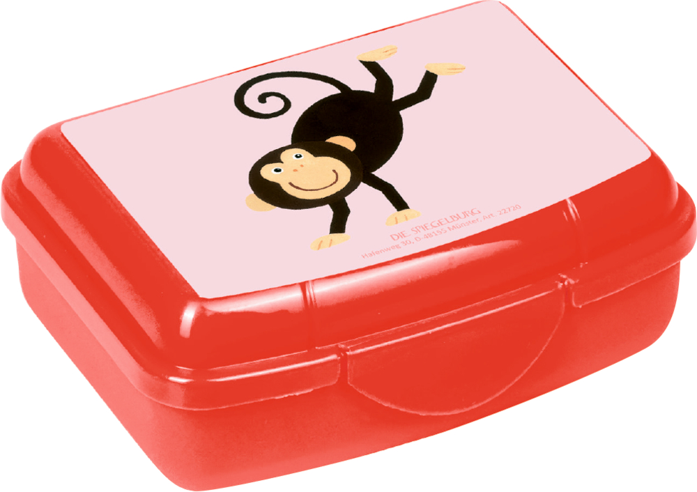 Kleine rote Lunchbox mit einer verspielten Cartoon-Affenillustration auf dem Deckel.