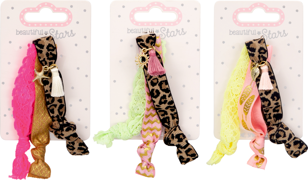 Drei Sets Tiermuster- und bunte Haargummis auf dekorativen Beautiful Stars Karten.