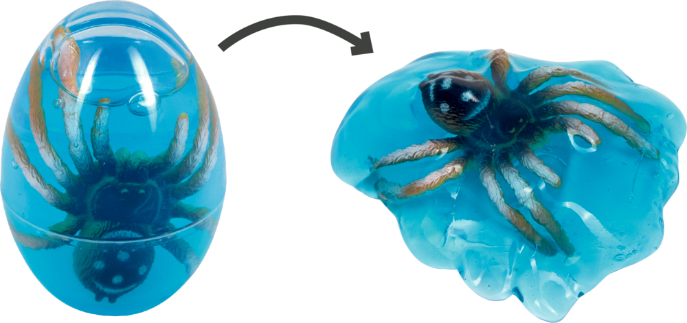 Blaues, eiförmiges Gel mit einer Spielzeugspinne darin, geschlossen und geöffnet dargestellt, um die Spinne freizugeben.