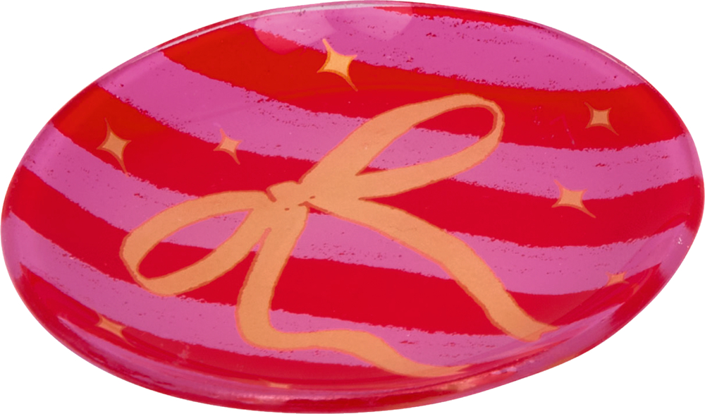 Roter Teller mit pinken Streifen, goldener Schleife und kleinen goldenen Sternen.