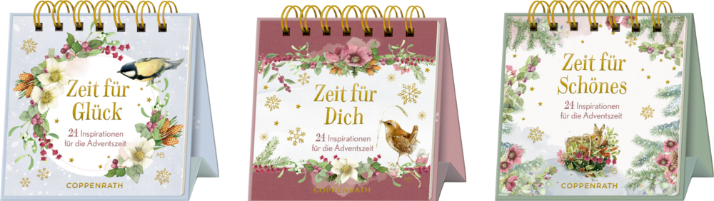 Drei Spiralaufstellbücher mit weihnachtlichen Floralmotiven und Tieren, jeweils mit Text „Zeit für Glück“, „Zeit für Dich“ und „Zeit für Schönes“.