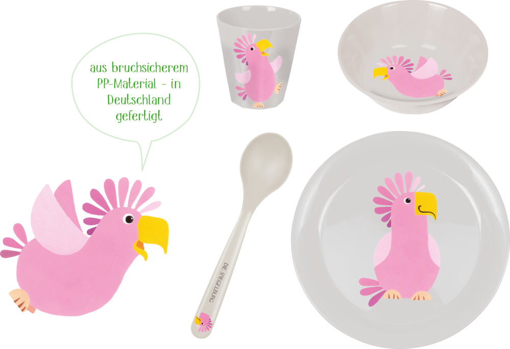 Kindergeschirrset mit rosa Papageienillustrationen und deutschem Text in einer Sprechblase.