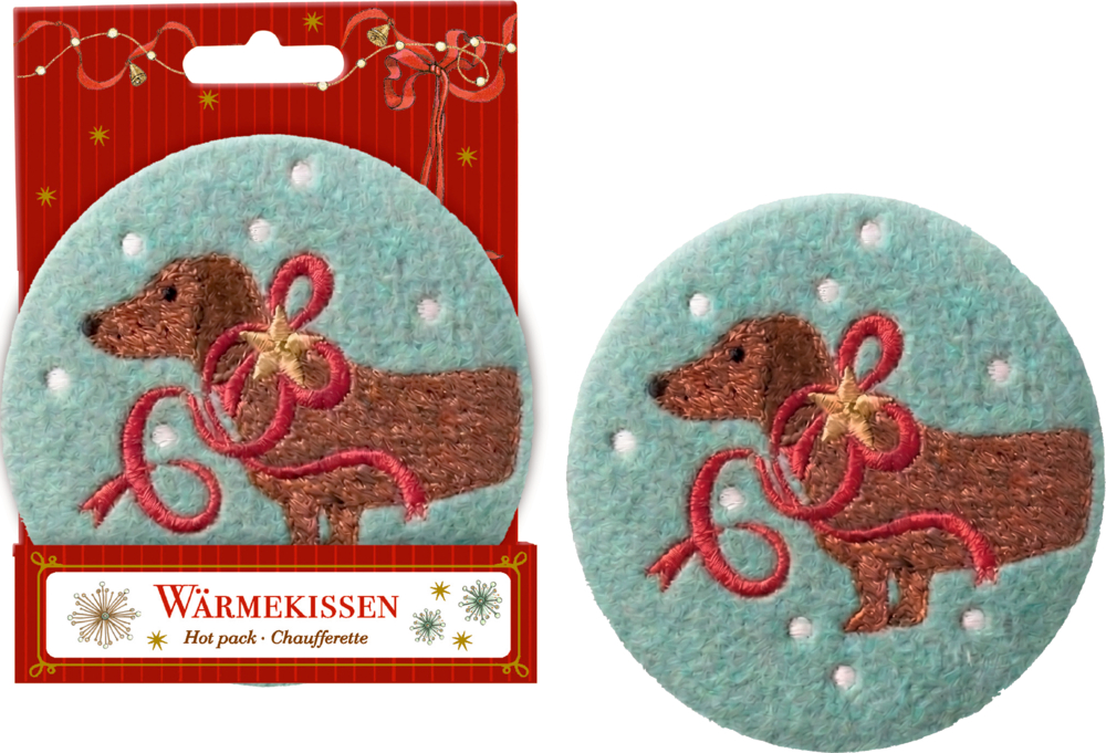 Rundes Wärmekissen mit gesticktem Dackelmotiv und roter Schleife auf eukalyptusfarbigem Hintergrund mit weißen Punkten.