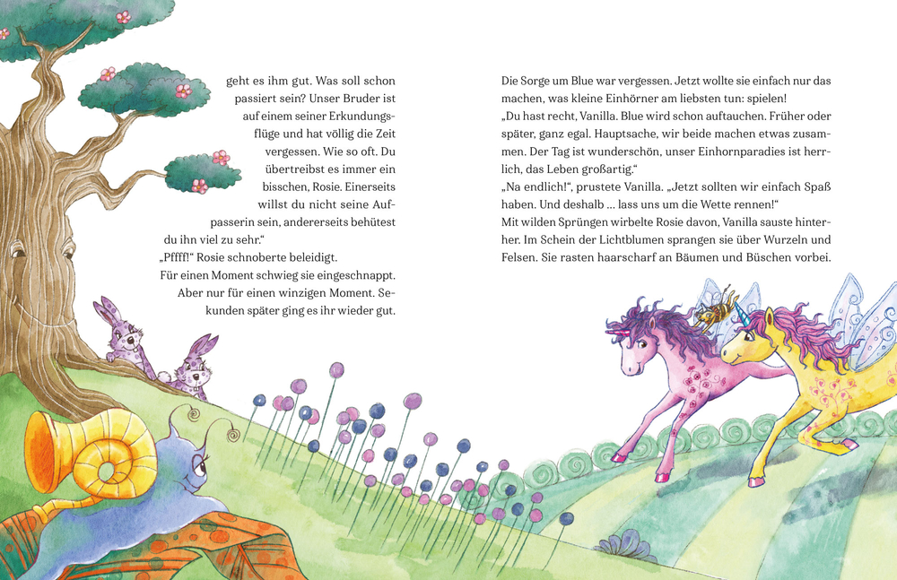 Ein Stapel „Der Zauberwunsch“-Einhornbücher neben einem Plüsch-Einhorn mit blauer Mähne und Flügeln.