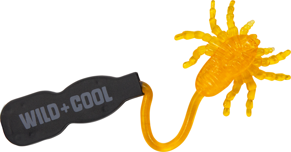 Ein gelber, klebriger Spielzeugkäfer haftet an einem schwarzen Greifer.