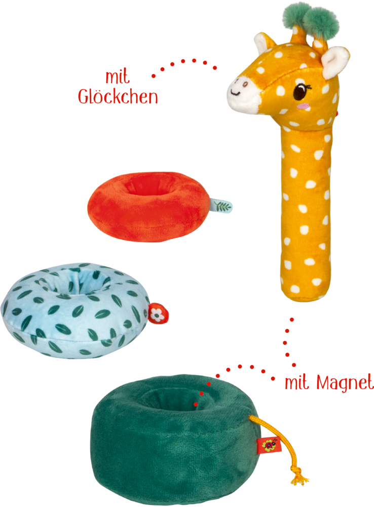 Drei bunte Stoffringe und ein gelber Giraffenkopf in Einzelteilen. Text: mit Glöckchen und mit Magnet.