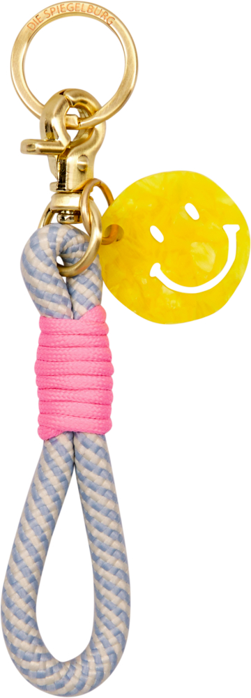 Schlüsselanhänger mit blau-grauem Seil, pinker Umwicklung und gelbem Smiley-Anhänger an einem goldenen Ring.