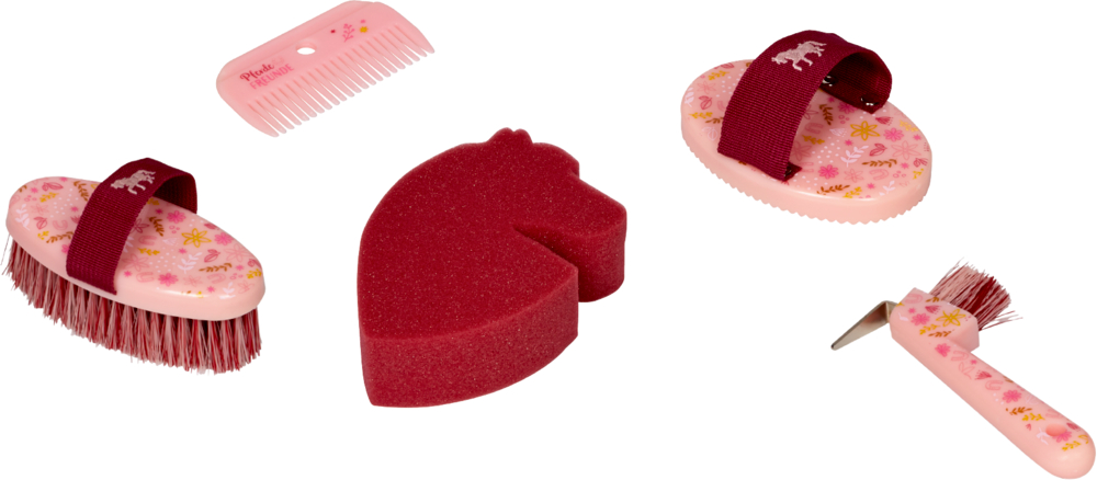Set mit fünf rosafarbenen Pferdepflegewerkzeugen: Bürsten, Hufkratzer, Kamm und ein Schwamm in Pferdeform.