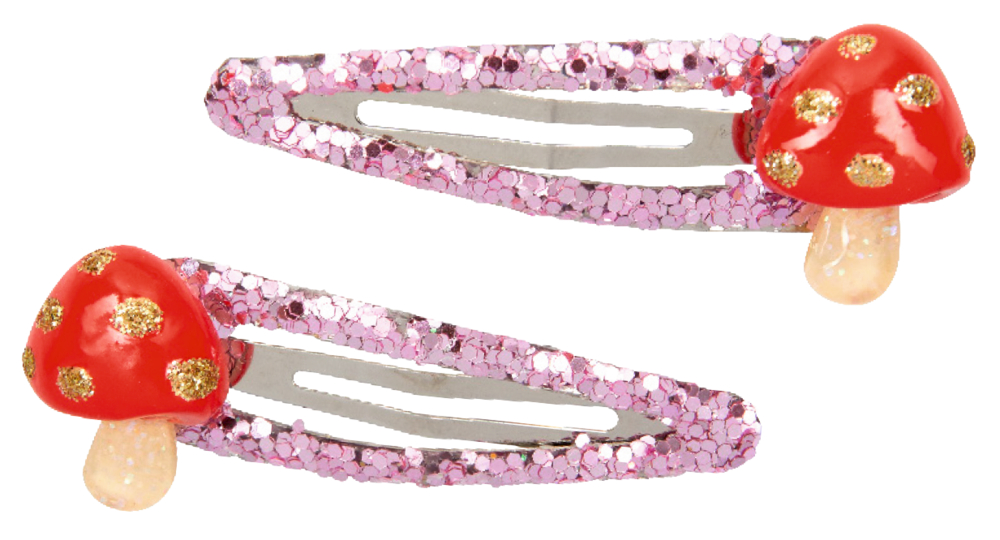 Zwei Haarspangen aus Metall mit rosa Glitzer und roten Pilzverzierungen mit goldenen Punkten.