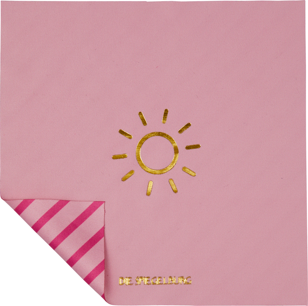 Rosa Tuch mit einer goldenen Sonne und einer rosa-weiß gestreiften Ecke.
