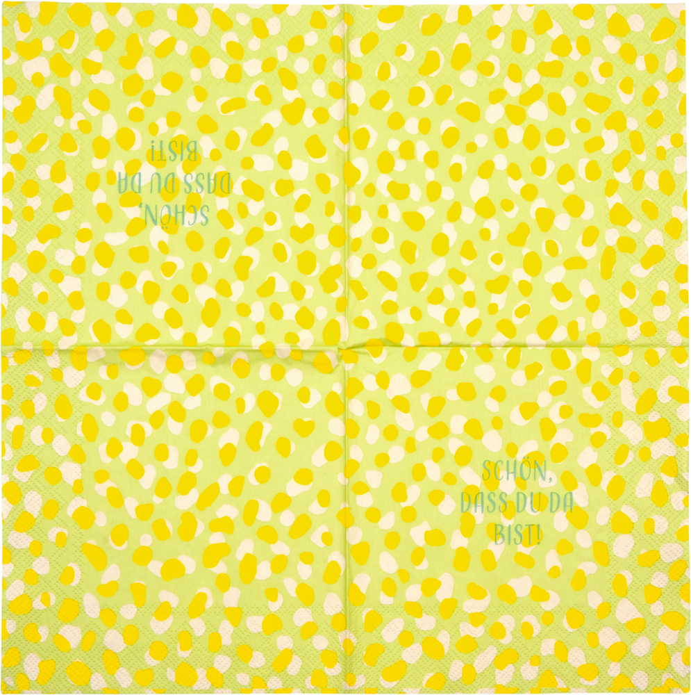 Gelbe Serviette mit Punktmuster und dem Text SCHÖN, DASS DU DA BIST in grüner Schrift.