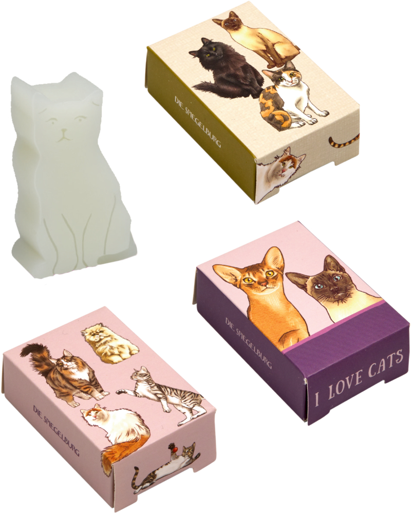 Drei bunte Schachteln mit Katzenmotiven und einem weißen Seifenstück in Katzenform.