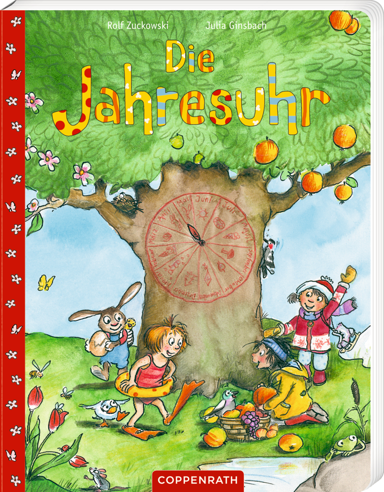 Kinder und Tiere spielen unter einem Baum neben einer Uhr, die auf dem Cover der Jahresuhr abgebildet ist.