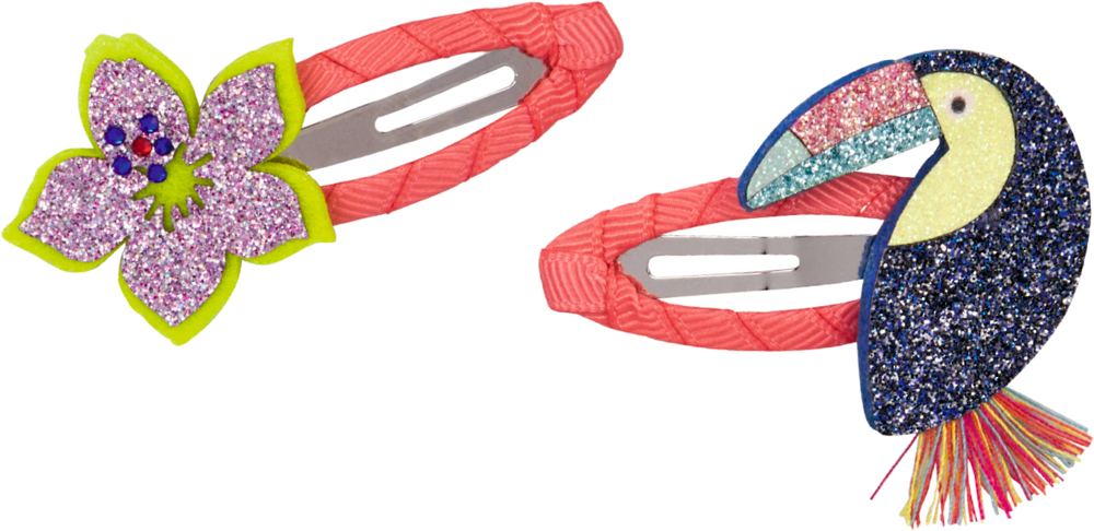 Zwei pinkfarbene Haarspangen, eine mit glitzernder Blume, eine mit funkelndem Tukan.