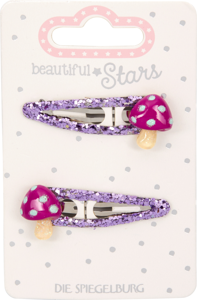 Zwei lila Glitzer-Haarspangen mit rot-weißen Pilz-Dekorationen auf einer „Beautiful Stars“-Karte.
