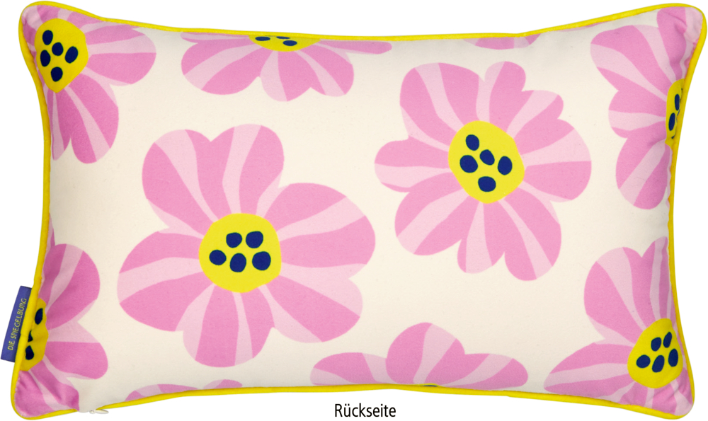 Rechteckiges Kissen mit pinken und gelben Blumen und gelber Paspelierung.