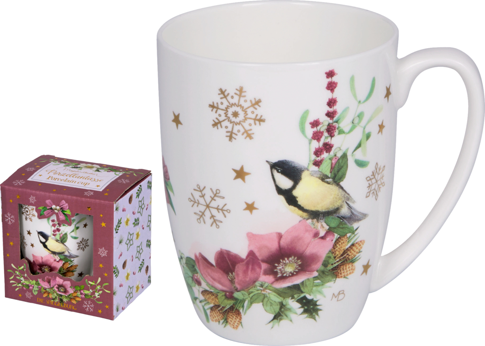 Weiße Porzellantasse mit Vogel-, Blüten- und goldenen Schneeflockendekor, daneben passende Geschenkverpackung.