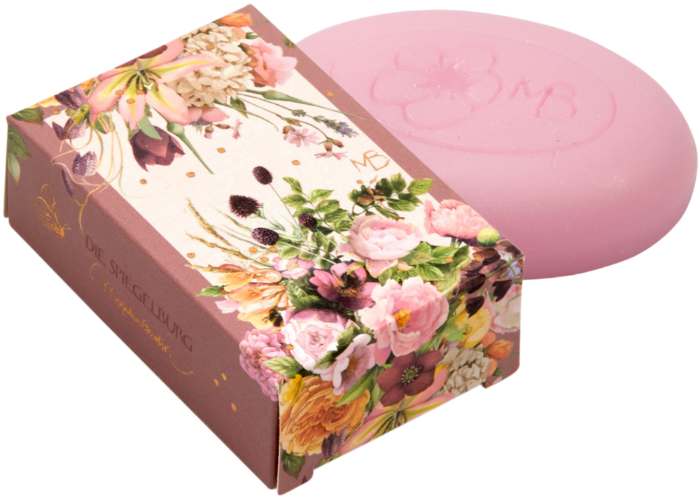 Rosa Seife in einer Schachtel mit Blumenmuster und bunten Blumen.