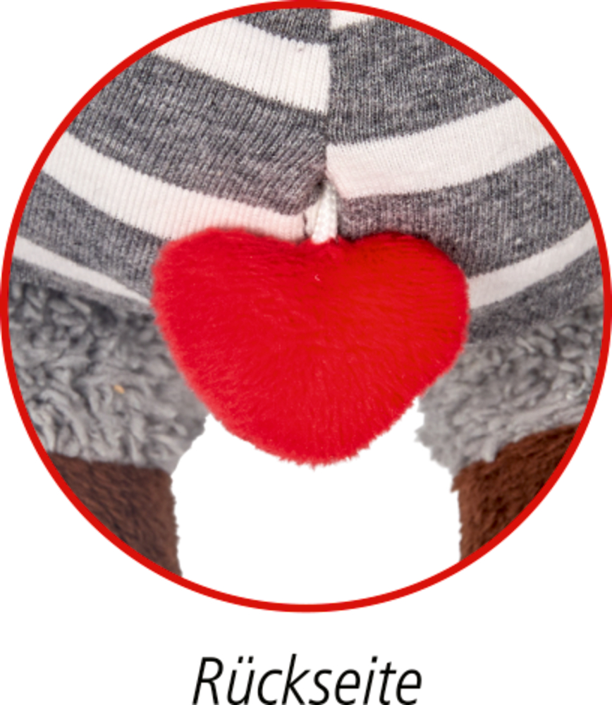 Ausschnitt eines Plüschtiers mit einem roten Herz-Detail an einer Schnur.