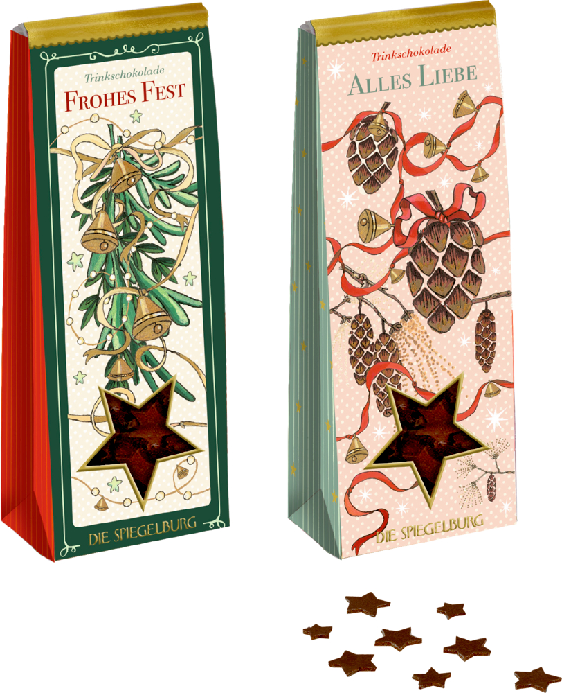 Zwei Verpackungen Trinkschokolade mit weihnachtlichen Motiven, eine grün mit Zweigen und Glocken, eine rosa mit Zapfen und roten Schleifen, davor Sternstücke. Beide mit Sichtfenster in Sternenform.