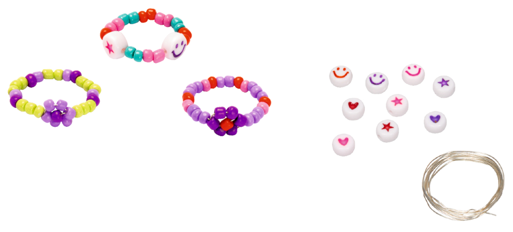 Drei Perlenringe, verschiedene Smiley- und Herzperlen sowie eine Spule aus durchsichtiger Schnur.