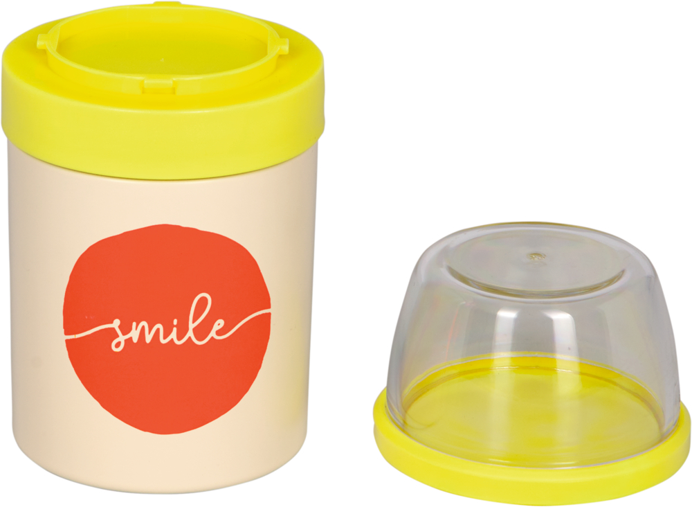 Cremefarbener Behälter mit gelbem Deckel und "smile" auf orangefarbenem Kreis. Ein durchsichtiger Aufsatz liegt daneben.