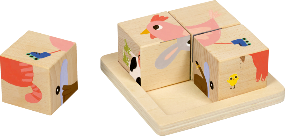 Vier naturfarbene Holzpuzzleblöcke mit bunten Tierabbildungen, ein Block liegt abseits.