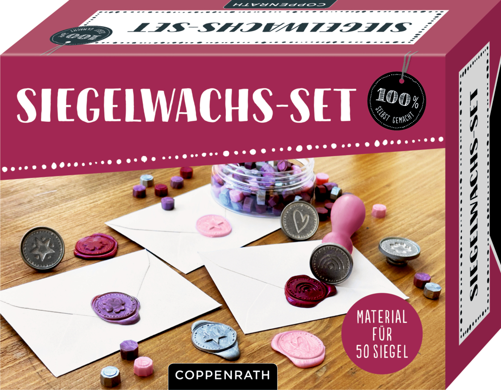 Siegelwachs-Set-Box mit Wachs und versiegelten Umschlägen auf einem Tisch angeordnet.