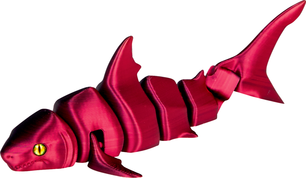 Ein segmentierter, glänzender roter Spielzeughai mit gelben Augen.