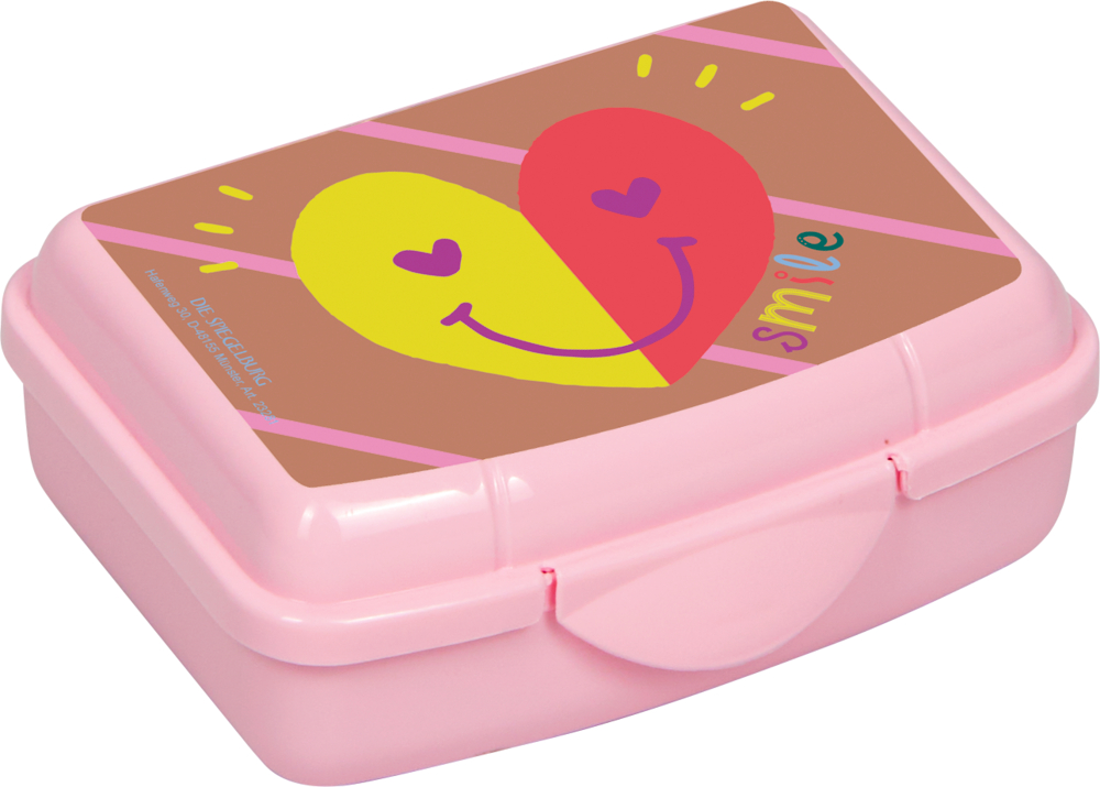 Eine pinke Lunchbox mit Herz-Motiv und dem Wort smile auf dem Deckel.