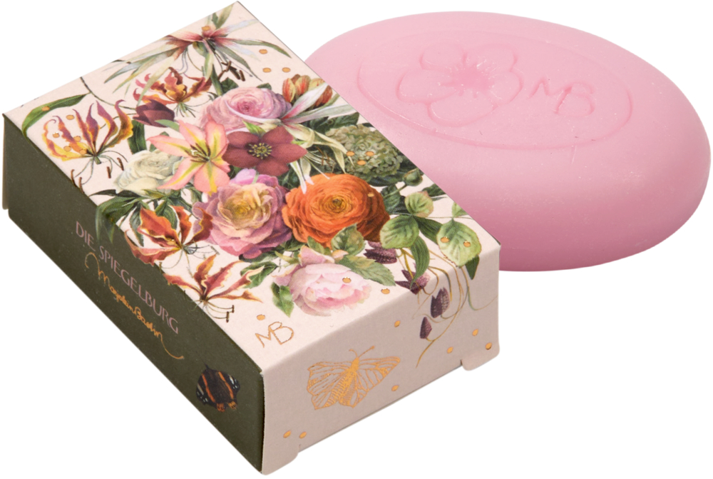 Rosa Seife neben einer Blumenschachtel mit einer Schmetterlingsillustration.
