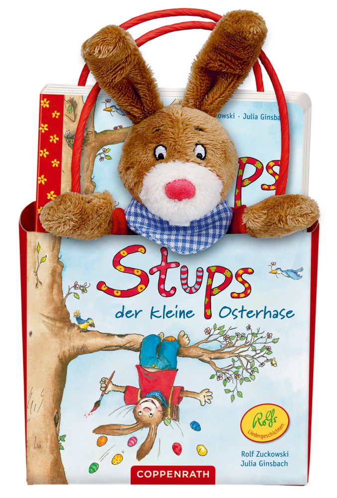 In einer roten Tasche sitzt ein Plüschhase mit dem Kinderbuch „Stups der kleine Osterhase“.