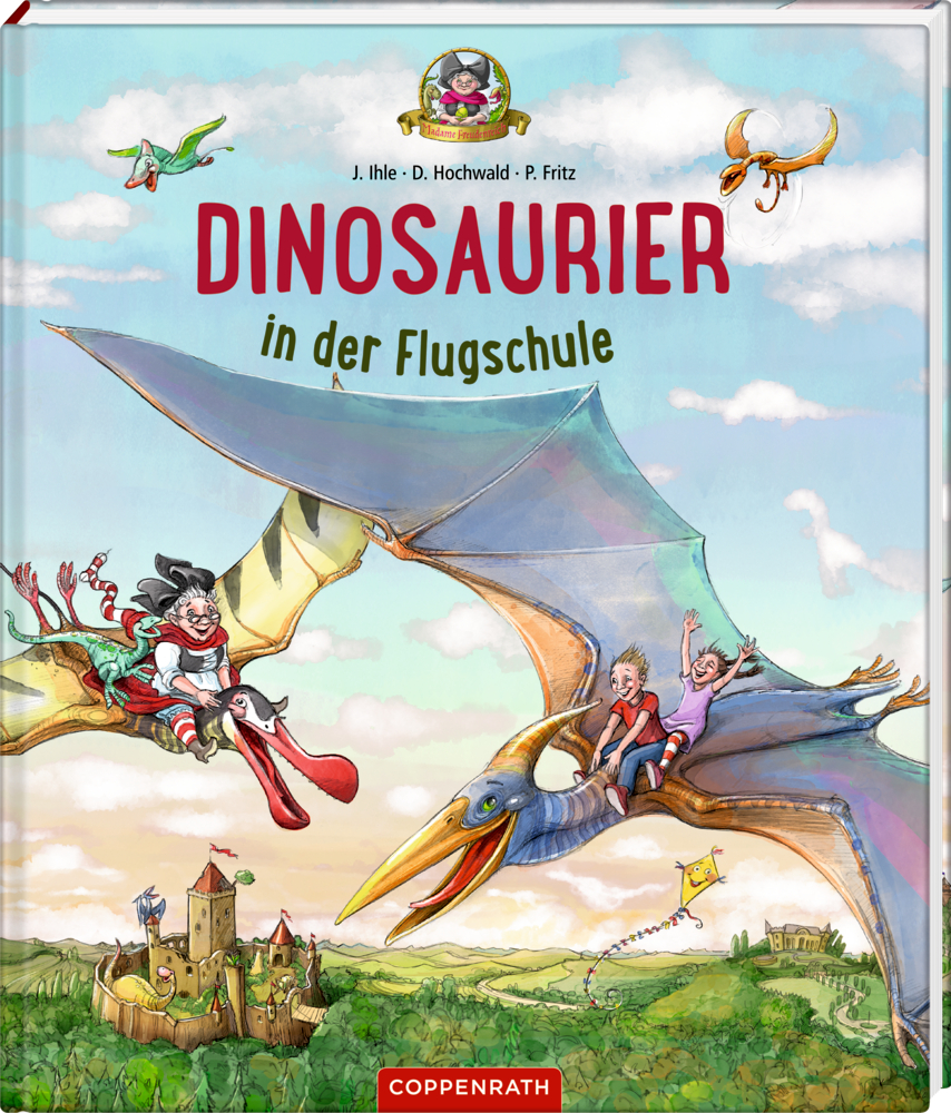 Kinder reiten auf fliegenden Dinosauriern über einer Burg mit dem Titel: „Dinosaurier in der Flugschule“.
