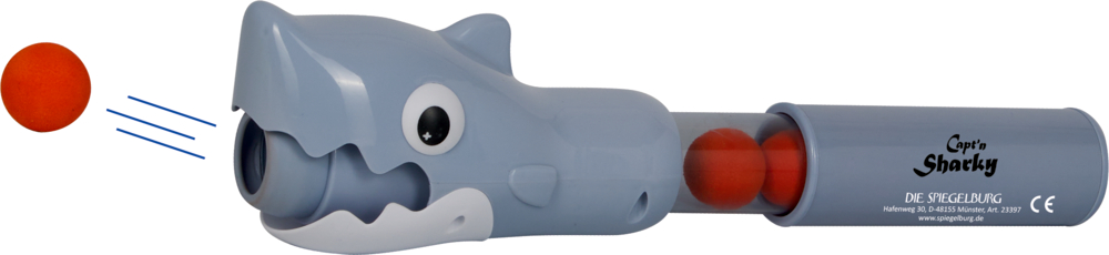 Toy Shark Shooter schießt einen orangefarbenen Schaumstoffball, zwei weitere Bälle befinden sich im Rohr.