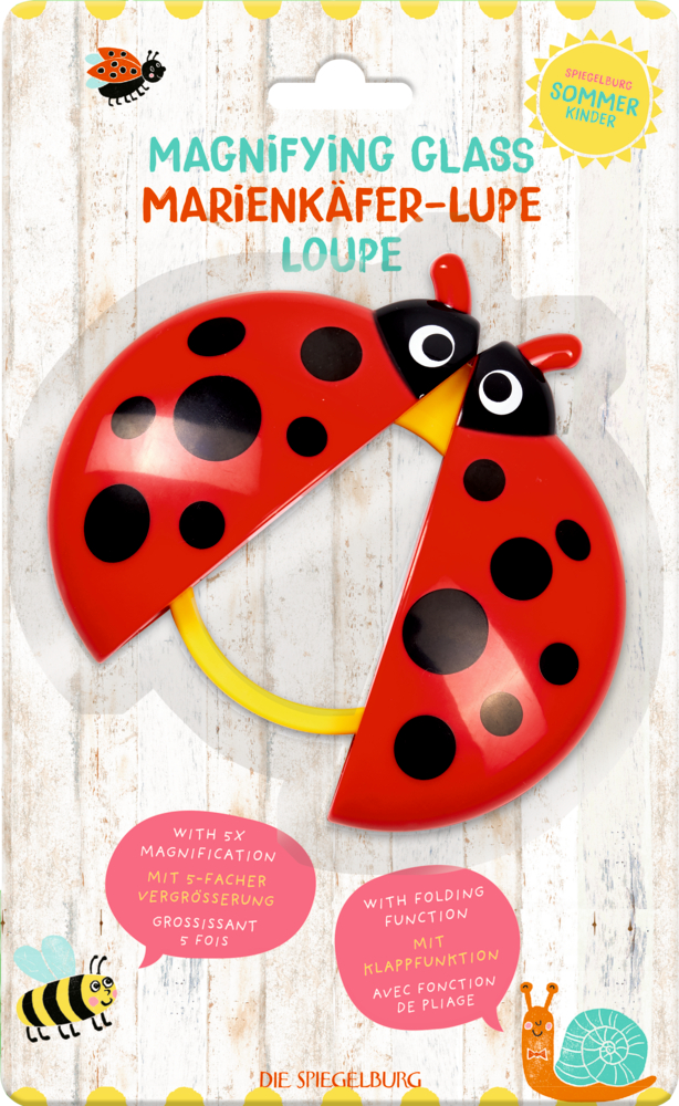 Lupenspielzeug in Marienkäferform mit roten Flügeln und schwarzen Punkten, abgebildet in der Verpackung.