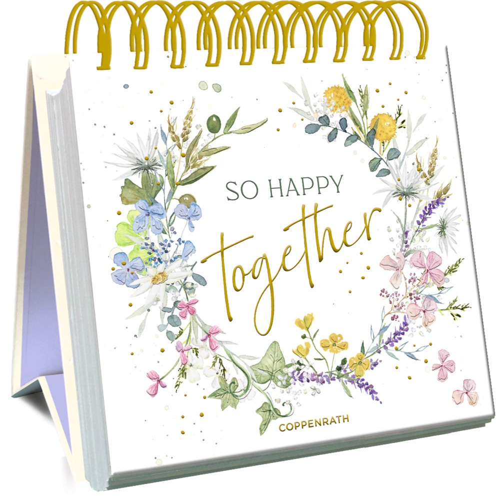 Großes Spiralaufstellbuch: So happy together Spiralgebundener Tischkalender mit einem Blumenkranz und dem Spruch „So Happy Together“ auf dem Cover.
