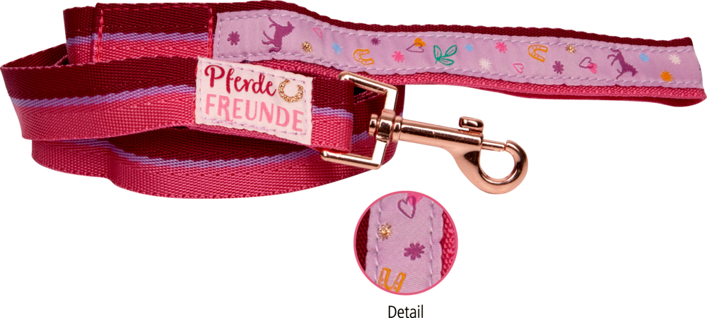 Rosa/rote Longierleine mit Pferde-, Blumen- und Hufeisenmotiven; mit einem Etikett von Pferde Freunde versehen.