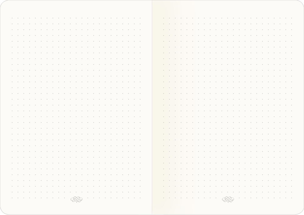 Notizbuch offen, punktierte Seiten, flach liegend, keine Schrift oder Markierungen sichtbar.