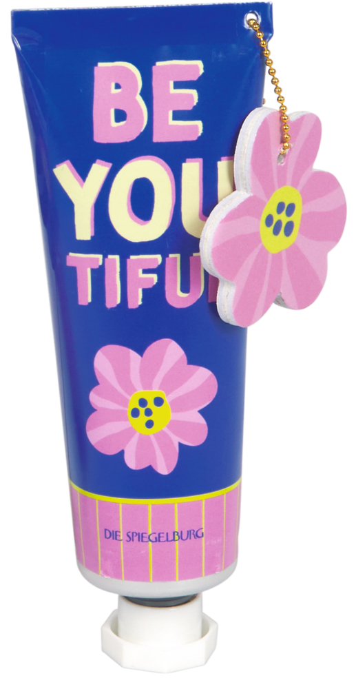 Ein blaues Cremetube mit BE YOU TIFUL Text und rosa Blumendesign, dazu ein rosa Blumenanhänger.
