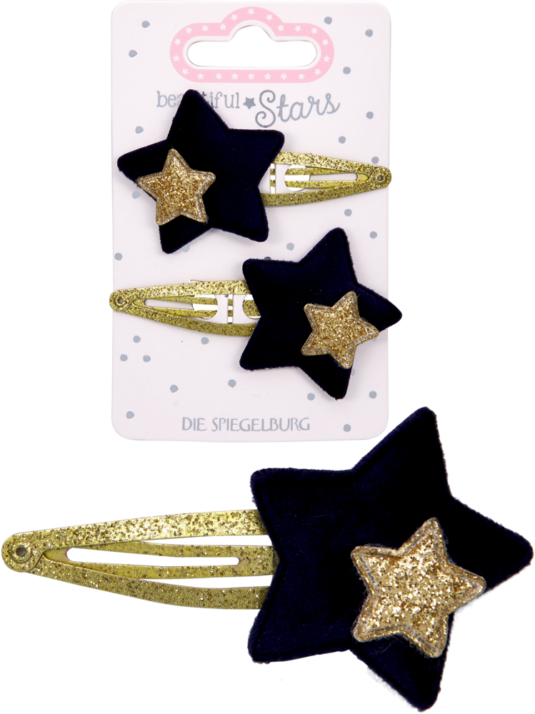 Eine goldfarbene Haarspange mit schwarzem Stern und kleinerem goldglitzerndem Stern in der Mitte, dadrüber zwei Haarspangen auf der Produktverpackung.