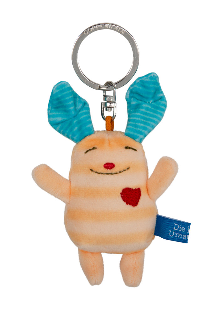 Plüsch-Anhänger mit blauen Ohren, rotem Herz-Patch und gestreiftem pfirsichfarbenem Körper, lachendes Gesicht.